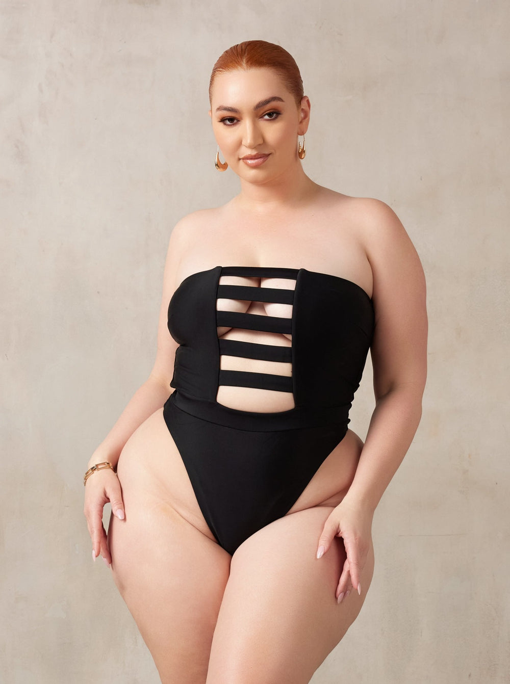 MBM Swim, Marcia B Maxwell high-cut Black cut-out one-piece swimsuit on beautiful midsize curve model, black owned #color_black
