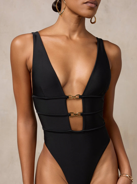 MBM Swim by Marcia B Maxwell black asymmetrical one-piece swimsuit monokini on model #color_black