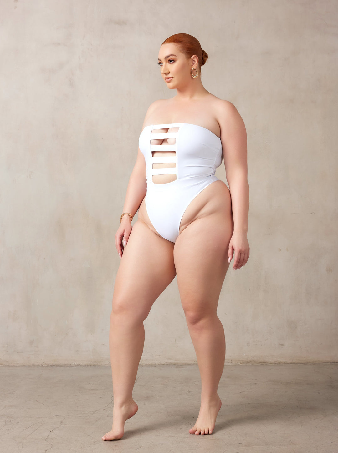 MBM Swim, Marcia B Maxwell high-cut white cut-out one-piece swimsuit on beautiful curve midsize model #color_white
