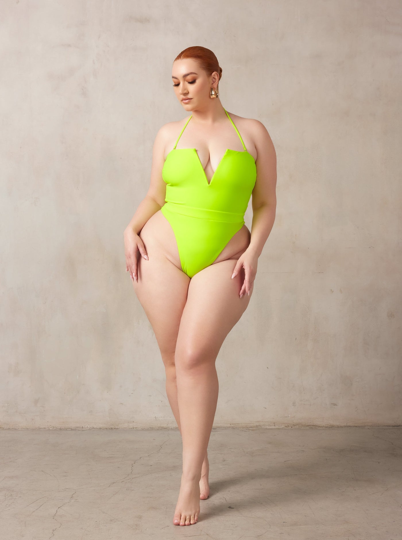 MBM Swim by Marcia B Maxwell neon green one-piece thong swimsuit monokini on curve midsize model #color_neon