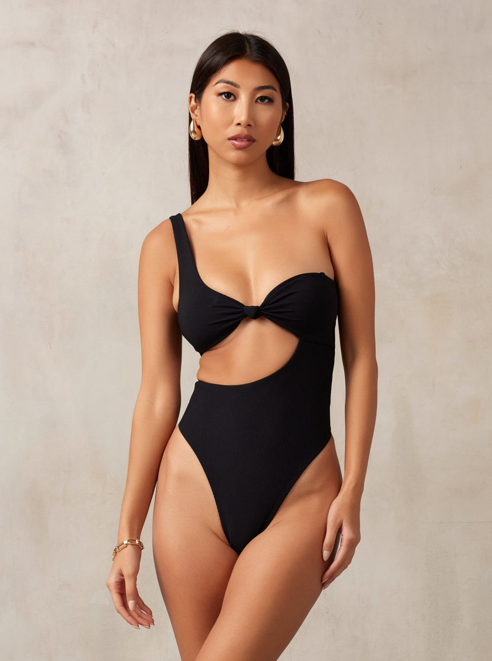 MBM Swim by Marcia B Maxwell ribbed black asymmetrical one-piece swimsuit monokini on model #color_black