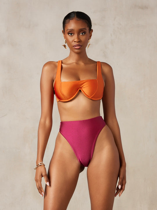 MBM Swim by Marcia B Maxwell model wearing multiway Chance bikini top and Passion bottoms in berry burgundy #color_burnt-orange