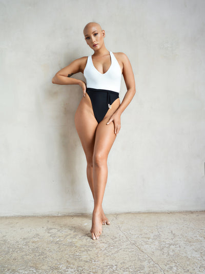 Model Jeana Turner wearing MBM Swim by Marcia B Maxwell Black and white Bliss one-piece swimsuit open back monokini