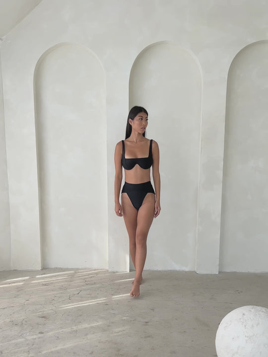 MBM Swim By Marcia B Maxwell model walk wearing black bikini Chance top and Aspire bottom #color_black
